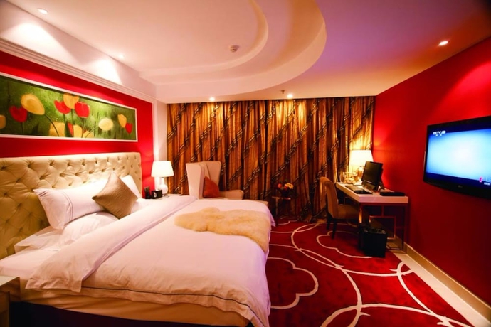 Imagen de la habitación del Hotel YINHAO HOLIDAY HOTEL. Foto 9