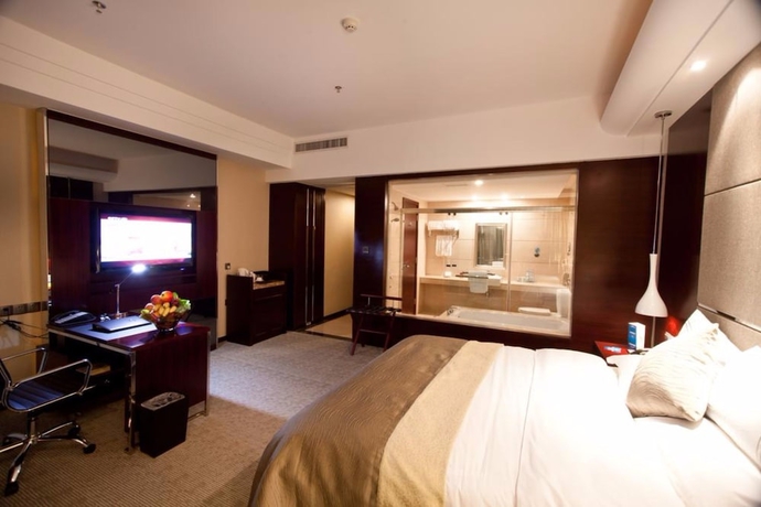 Imagen de la habitación del Hotel YINHAO HOLIDAY HOTEL. Foto 10