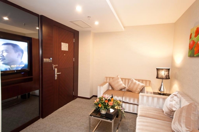 Imagen de la habitación del Hotel YINHAO HOLIDAY HOTEL. Foto 11