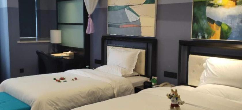 Imagen de la habitación del Hotel YOLANDA HOTEL (ZHENGZHOU CBD EXHIBITION CENTER). Foto 11