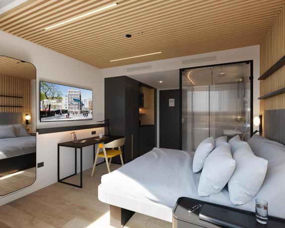 Imagen de la habitación del Hotel YOTELPAD London Stratford. Foto 4