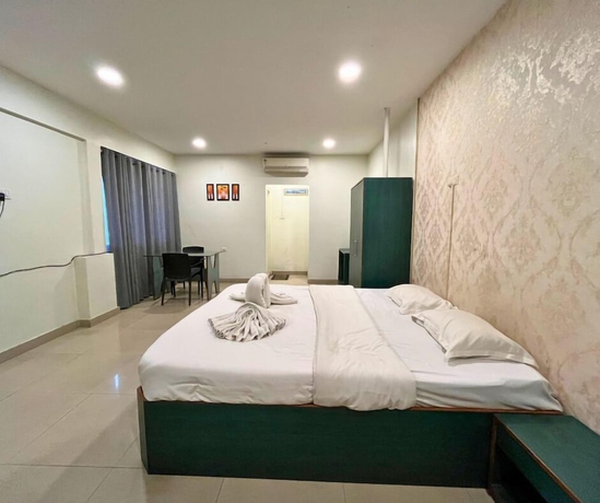 Imagen de la habitación del Hotel YSM Grand, Guwahati. Foto 5