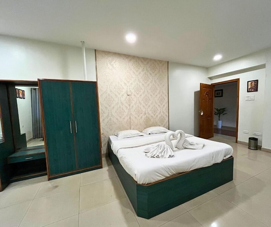 Imagen de la habitación del Hotel YSM Grand, Guwahati. Foto 6