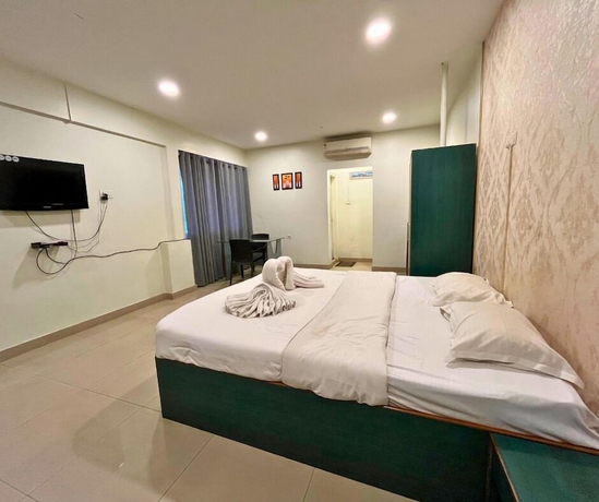 Imagen de la habitación del Hotel YSM Grand, Guwahati. Foto 7