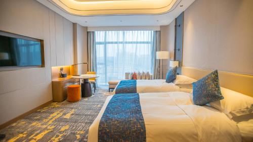 Imagen de la habitación del Hotel YTL OuYue International. Foto 17