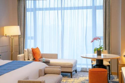 Imagen de la habitación del Hotel YTL OuYue International. Foto 19