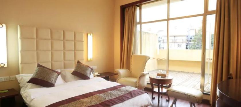 Imagen de la habitación del Hotel YUANHUA INTERNATIONAL HOTEL. Foto 10