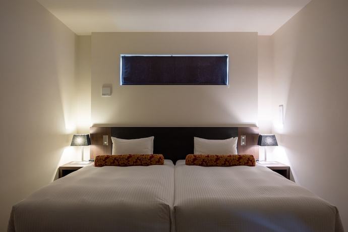 Imagen de la habitación del Hotel YUMIHA OKINAWA. Foto 14