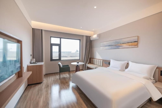 Imagen de la habitación del Hotel YUNMANJIANYE HOTEL. Foto 8