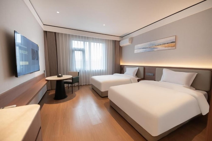 Imagen de la habitación del Hotel YUNMANJIANYE HOTEL. Foto 10