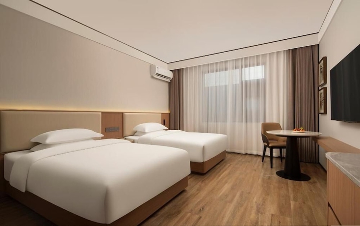 Imagen de la habitación del Hotel YUNMANJIANYE HOTEL. Foto 11