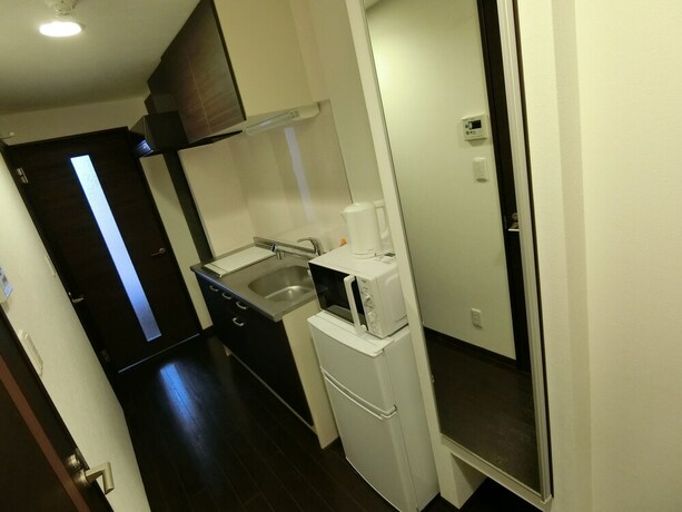 Imagen de la habitación del Hotel Yado At Tshuruhashi Extsu103. Foto 20