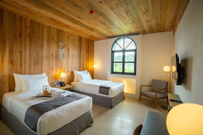 Imagen de la habitación del Hotel Yama Resort. Foto 18
