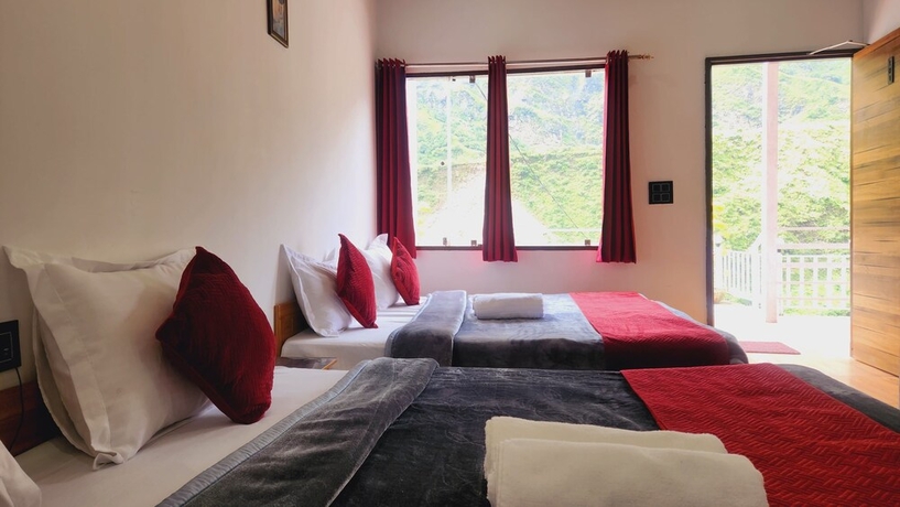 Imagen de la habitación del Hotel Yamunotri Heli Resort. Foto 7