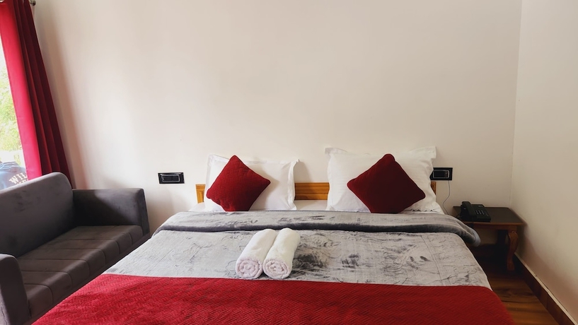 Imagen de la habitación del Hotel Yamunotri Heli Resort. Foto 10