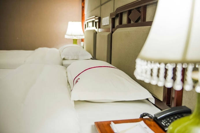 Imagen de la habitación del Hotel Yangshuo New Century Vip Building. Foto 4