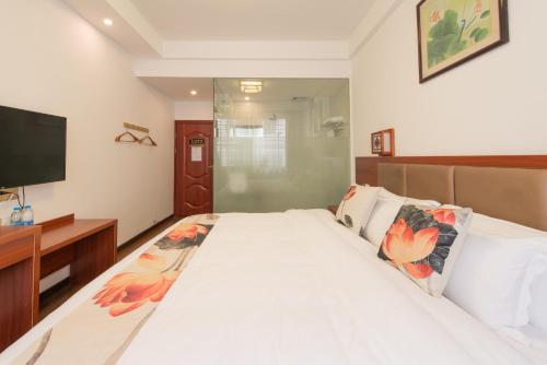 Imagen de la habitación del Hotel Yangshuo Xiangyi Inn. Foto 8