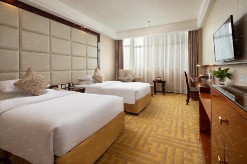 Imagen de la habitación del Hotel Yangzi International. Foto 17