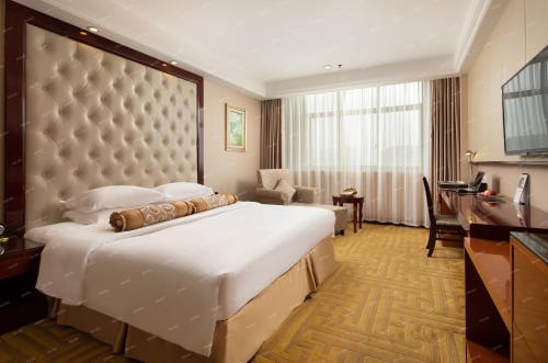 Imagen de la habitación del Hotel Yangzi International. Foto 18