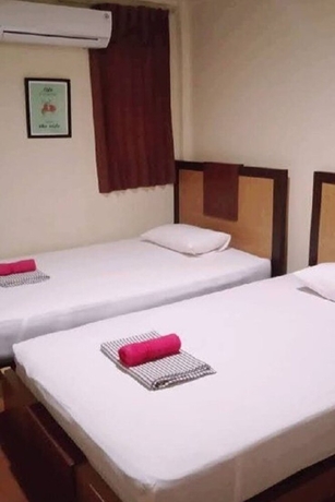 Imagen de la habitación del Hotel Yani Homestay. Foto 2