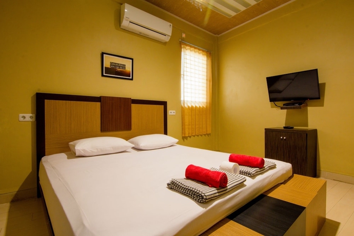 Imagen de la habitación del Hotel Yani Homestay. Foto 6