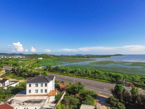 Imagen de la habitación del Hotel Yansu Sport Culture Guesthouse. Foto 8