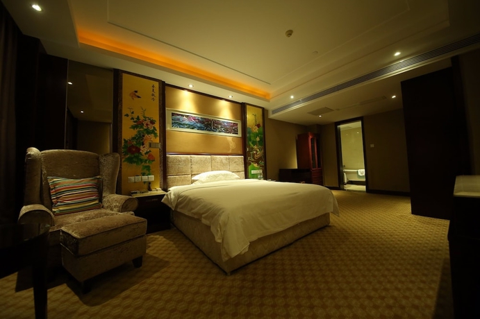 Imagen de la habitación del Hotel Yantai Asia. Foto 2