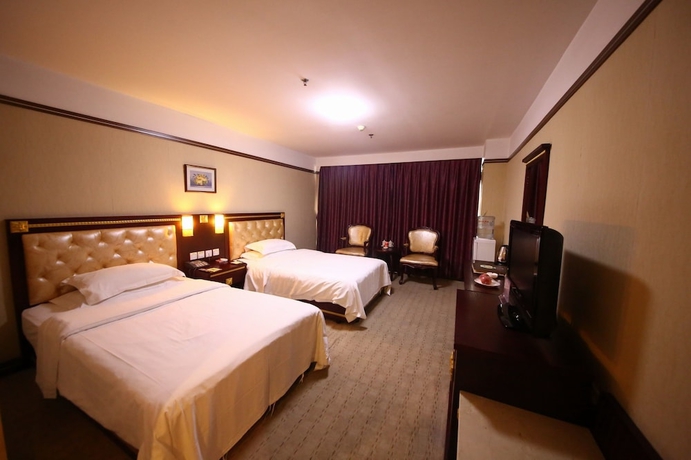 Imagen de la habitación del Hotel Yantai Asia. Foto 4