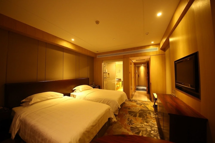 Imagen de la habitación del Hotel Yantai Asia. Foto 5