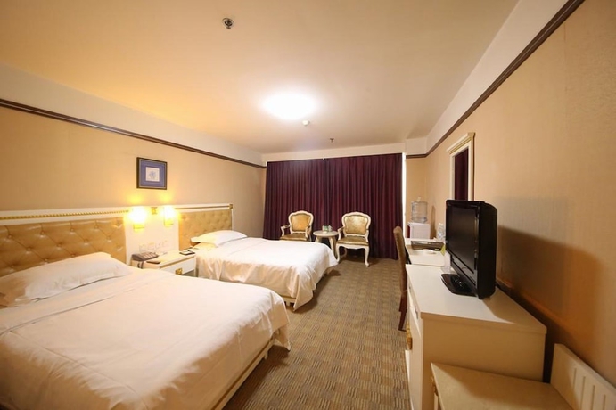 Imagen de la habitación del Hotel Yantai Asia. Foto 6