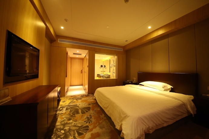 Imagen de la habitación del Hotel Yantai Asia. Foto 9