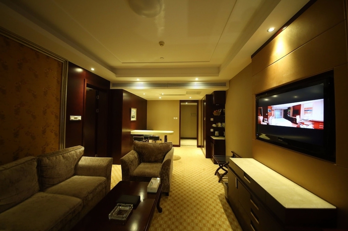 Imagen de la habitación del Hotel Yantai Asia. Foto 13