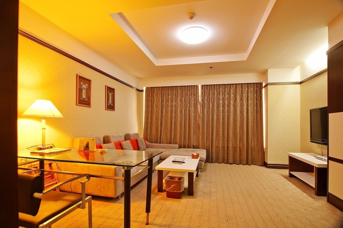 Imagen de la habitación del Hotel Yantai Asia. Foto 15