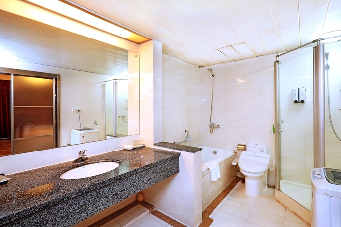 Imagen de la habitación del Hotel Yantai Asia. Foto 17