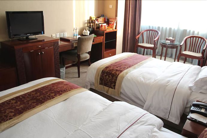 Imagen de la habitación del Hotel Yantai Golden Beach Hotel. Foto 2
