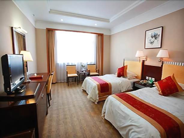 Imagen de la habitación del Hotel Yantai Golden Beach Hotel. Foto 3