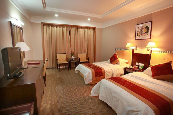 Imagen de la habitación del Hotel Yantai Golden Beach Hotel. Foto 4
