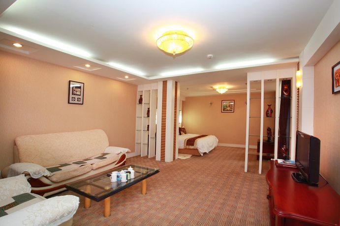 Imagen de la habitación del Hotel Yantai Golden Beach Hotel. Foto 5