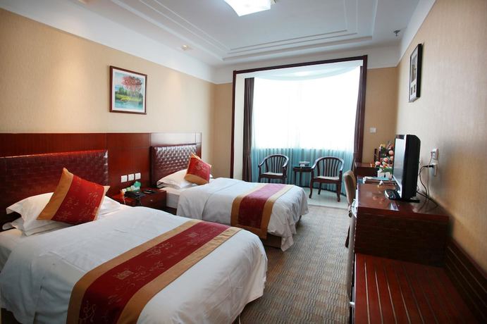 Imagen de la habitación del Hotel Yantai Golden Beach Hotel. Foto 7