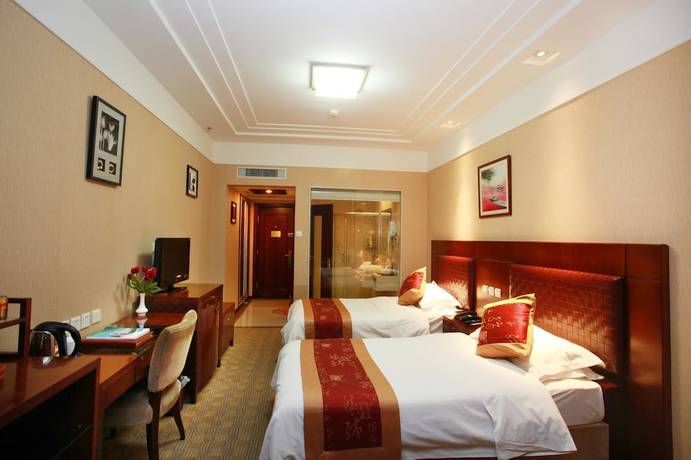Imagen de la habitación del Hotel Yantai Golden Beach Hotel. Foto 8