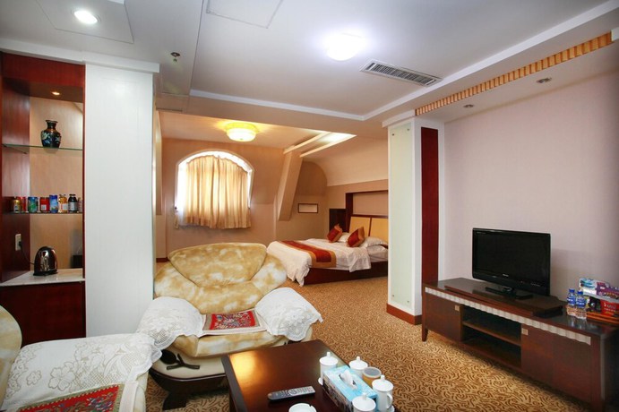 Imagen de la habitación del Hotel Yantai Golden Beach Hotel. Foto 9