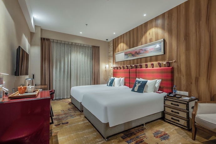 Imagen de la habitación del Hotel Yantai Lijing Peninsula. Foto 11