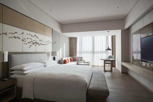 Imagen de la habitación del Hotel Yantai Marriott. Foto 3