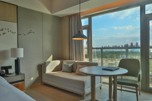 Imagen de la habitación del Hotel Yantai Marriott. Foto 7