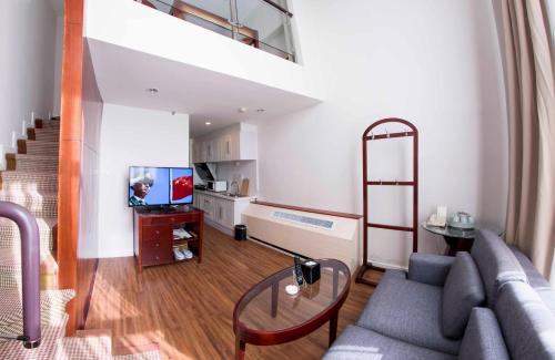 Imagen de la habitación del Hotel Yantai Meiya International Apt.. Foto 7