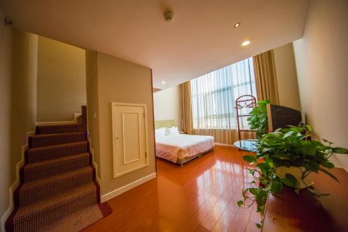 Imagen de la habitación del Hotel Yantai Meiya International Apt.. Foto 8