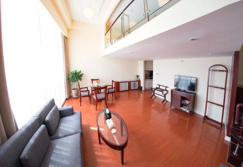 Imagen de la habitación del Hotel Yantai Meiya International Apt.. Foto 9