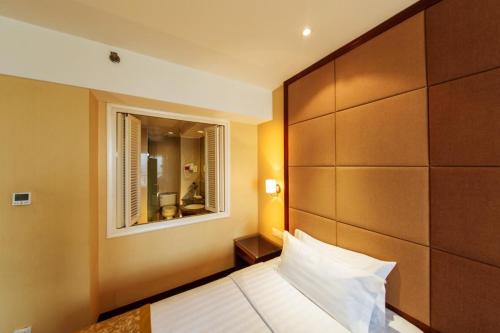 Imagen de la habitación del Hotel Yantai Meiya International Apt.. Foto 10