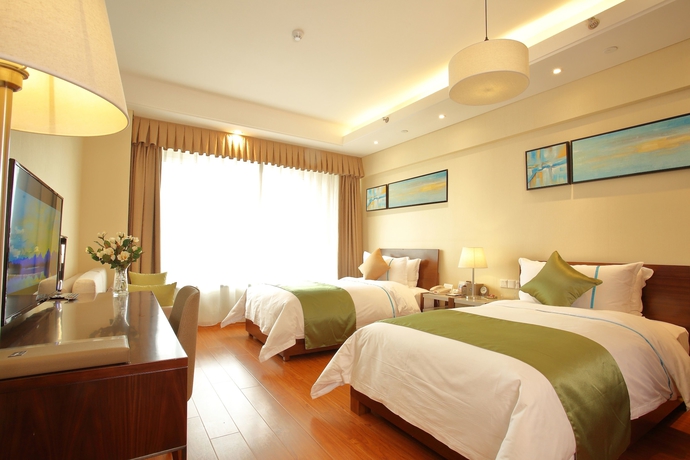 Imagen de la habitación del Hotel Yantai Tianma Argyle Suites. Foto 6
