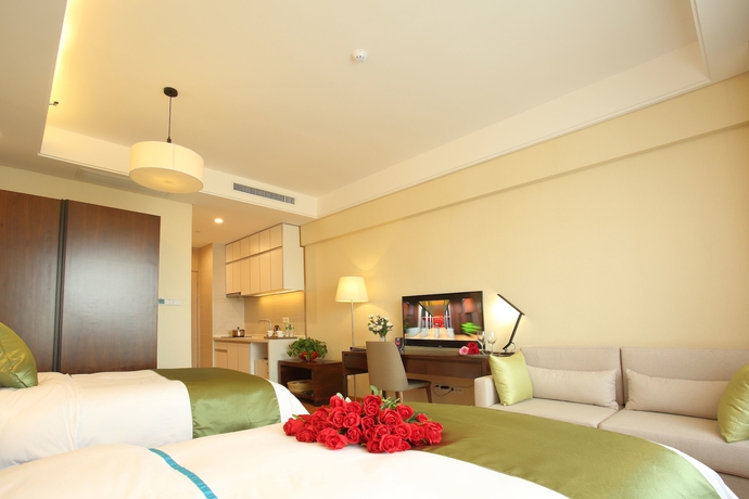Imagen de la habitación del Hotel Yantai Tianma Argyle Suites. Foto 9